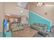 Spacious living room showing kitchen, breakfast bar, vaulted ceilings, and comfortable seating arrangement at 3700 Golf Colony Lane # 20-L, Little River, SC 29566