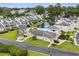 Aerial view of a community with a pool, clubhouse, and picturesque landscaping at 3833 Myrtle Pointe Dr. # 18 Bu 3, Myrtle Beach, SC 29577