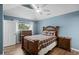 Cozy bedroom with a plaid bedspread, wooden furniture, and a ceiling fan at 3833 Myrtle Pointe Dr. # 18 Bu 3, Myrtle Beach, SC 29577