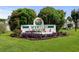 Entrance sign to Myrtle Point with landscaped bushes and American flags at 3833 Myrtle Pointe Dr. # 18 Bu 3, Myrtle Beach, SC 29577