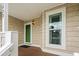 Charming entryway with green door, window and neutral siding at 3833 Myrtle Pointe Dr. # 18 Bu 3, Myrtle Beach, SC 29577