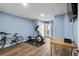 Well-lit exercise room featuring a bicycle, elliptical machine, and a mounted television at 3833 Myrtle Pointe Dr. # 18 Bu 3, Myrtle Beach, SC 29577
