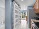 Modern kitchen view with stainless appliances and barn door pantry at 3833 Myrtle Pointe Dr. # 18 Bu 3, Myrtle Beach, SC 29577