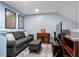 Inviting living room featuring a comfortable sofa, an ottoman, and a media console with a TV at 3833 Myrtle Pointe Dr. # 18 Bu 3, Myrtle Beach, SC 29577