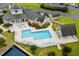 Aerial view of a community pool with lounge chairs and well-maintained landscaping at 3833 Myrtle Pointe Dr. # 18 Bu 3, Myrtle Beach, SC 29577
