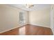 A standard empty bedroom with wood floors, white trim, and a ceiling fan at 403 75Th Ave N # C, Myrtle Beach, SC 29572