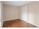 A vacant bedroom features wood flooring, neutral walls and a door at 403 75Th Ave N # C, Myrtle Beach, SC 29572