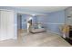 Inviting living room features wood paneled fireplace, and access to kitchen, complete with tile flooring at 403 75Th Ave N # C, Myrtle Beach, SC 29572