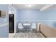 Living space with small table setting open to a quaint kitchen at 403 75Th Ave N # C, Myrtle Beach, SC 29572