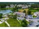 Aerial view of multi-story building with landscaping, pond, and parking at 4101 Pinehurst Circle # Aa-3, Little River, SC 29566
