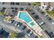 Aerial view of a condo pool area surrounded by parking and manicured landscaping at 4101 Pinehurst Circle # Aa-3, Little River, SC 29566