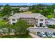 Aerial view of multi-Gathering building featuring parking and a green lawn at 4101 Pinehurst Circle # Aa-3, Little River, SC 29566