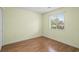 Bright bedroom space featuring wood-style flooring and a window view at 4101 Pinehurst Circle # Aa-3, Little River, SC 29566