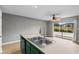 Bright and modern kitchen featuring countertops, stainless steel double sink, and backyard view at 4101 Pinehurst Circle # Aa-3, Little River, SC 29566