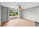 Spacious living area features sliding glass doors to a balcony and a decorative ceiling fan at 4101 Pinehurst Circle # Aa-3, Little River, SC 29566