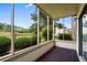 Screened porch overlooks exterior with landscape views at 4101 Pinehurst Circle # Aa-3, Little River, SC 29566