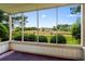 Screened patio with view of landscaped grounds and building in distance at 4101 Pinehurst Circle # Aa-3, Little River, SC 29566