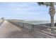 Picturesque boardwalk leading to the beach with ocean views and a clear sky overhead at 415 Ocean Creek Dr. # 2372, Myrtle Beach, SC 29572