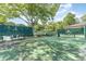 Outdoor tennis court with players and green surroundings in a vibrant community setting at 415 Ocean Creek Dr. # 2372, Myrtle Beach, SC 29572