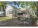 Spacious backyard with hot tub on the deck, and mature trees at 4196 Ravenwood Dr., Little River, SC 29566