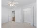 Bright bedroom with a ceiling fan and open closet space at 4196 Ravenwood Dr., Little River, SC 29566