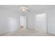 Bedroom showcases neutral walls and carpet, a ceiling fan, and closet space at 4196 Ravenwood Dr., Little River, SC 29566