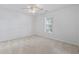 Bedroom features neutral carpeting, a ceiling fan, and a window providing natural light at 4196 Ravenwood Dr., Little River, SC 29566
