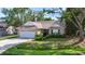 Charming brick home featuring an attached garage and manicured landscaping at 4196 Ravenwood Dr., Little River, SC 29566