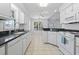 Eat-in kitchen with white cabinets and stainless-steel appliances at 4196 Ravenwood Dr., Little River, SC 29566