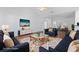 Staged living room showcases hardwood floors, and a comfortable seating area with contemporary decor at 4196 Ravenwood Dr., Little River, SC 29566