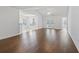 Spacious living room with hardwood floors, vaulted ceilings, and access to the backyard at 4196 Ravenwood Dr., Little River, SC 29566