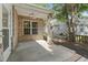 Covered patio with ceiling fan, brick columns, and concrete flooring at 4196 Ravenwood Dr., Little River, SC 29566