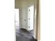 Hallway with dark vinyl plank flooring and white trim at 4333 Oakwood Circle, Little River, SC 29566