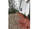 Side yard featuring manicured landscaping and mature trees at 4333 Oakwood Circle, Little River, SC 29566