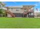 Backyard features a multi-level deck and a lush lawn for outdoor activities at 4600 Murrells Inlet Rd., Murrells Inlet, SC 29576