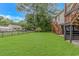 Spacious backyard featuring stairs and a well-maintained grassy lawn for outdoor enjoyment at 4600 Murrells Inlet Rd., Murrells Inlet, SC 29576
