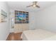 Modern bedroom featuring a large built-in unit, hardwood floors, and neutral decor at 4600 Murrells Inlet Rd., Murrells Inlet, SC 29576
