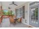 Inviting covered porch with comfortable seating, perfect for outdoor relaxation and enjoyment at 4600 Murrells Inlet Rd., Murrells Inlet, SC 29576