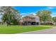 Exterior of home featuring covered parking, a wood porch, and an American flag at 4600 Murrells Inlet Rd., Murrells Inlet, SC 29576