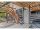 Exterior featuring stairs, a door, and lattice with exposed wooden beams at 4600 Murrells Inlet Rd., Murrells Inlet, SC 29576