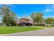 Exterior of home featuring covered parking, a wood porch, and an American flag at 4600 Murrells Inlet Rd., Murrells Inlet, SC 29576