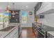 Bright, open kitchen featuring stainless steel appliances, gray cabinets, and white subway tile at 4600 Murrells Inlet Rd., Murrells Inlet, SC 29576