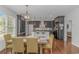 Elegant kitchen and dining area with modern appliances and stylish lighting fixtures at 4600 Murrells Inlet Rd., Murrells Inlet, SC 29576