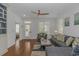 Cozy living room featuring hardwood floors, comfortable seating, and a view to the outdoor patio at 4600 Murrells Inlet Rd., Murrells Inlet, SC 29576
