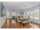 Open-concept living space showcasing hardwood floors, abundant natural light, and stylish modern furnishings at 4600 Murrells Inlet Rd., Murrells Inlet, SC 29576