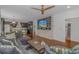 Spacious living area with comfortable seating, a modern TV built-in, and seamless flow to the kitchen at 4600 Murrells Inlet Rd., Murrells Inlet, SC 29576