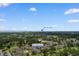 Aerial view of a building complex in Myrtle Beach, surrounded by golf courses and greenery at 4673 Wild Iris Dr. # 21-201, Myrtle Beach, SC 29577