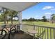 View from a balcony featuring outdoor furniture, a bicycle, and a scenic view of a golf course at 4673 Wild Iris Dr. # 21-201, Myrtle Beach, SC 29577