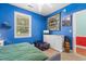 Blue bedroom featuring a large window and white dresser at 4673 Wild Iris Dr. # 21-201, Myrtle Beach, SC 29577