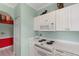 Bright kitchen with white appliances, white cabinetry, and light-colored walls at 4673 Wild Iris Dr. # 21-201, Myrtle Beach, SC 29577